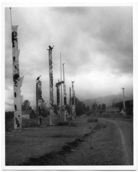 Totem poles along a road