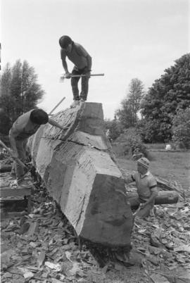 [Norman, Isaac and Chip continue shaping hull]