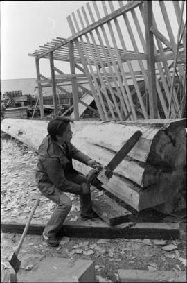 Crew working on log at the Turnbull & Gail construction yard in Richmond (contractors for bui...