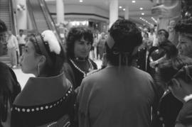 [Reva assists unidentified person with face paint]