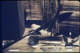 A paddle, spindle whorl, and other items on display in Montréal