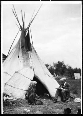 Portrait of two men in front of tipi, view three