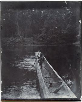 Child in canoe, Upper Mimika