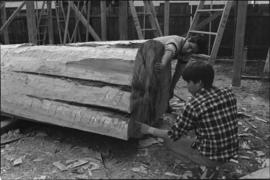 Crew working on log at the Turnbull & Gail construction yard in Richmond (contractors for bui...