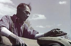 Mungo Martin working on a totem pole