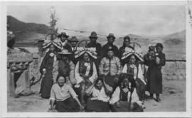People wearing traditional clothes posed for photograph
