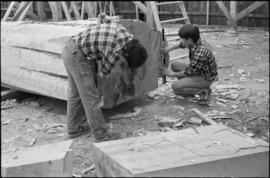 Crew working on log at the Turnbull & Gail construction yard in Richmond (contractors for bui...
