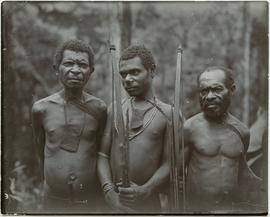 Local men heights about 4 ft. 7, 4 ft. 6 and 4 ft. 3 [New Guinea]
