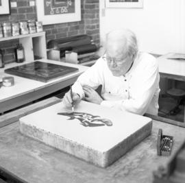 [Bill Reid drawing on lithographic stone]
